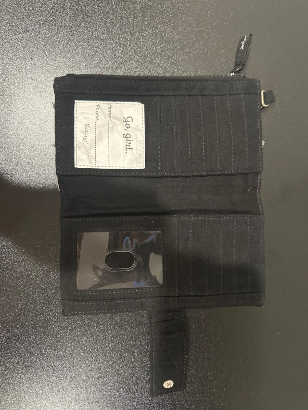 Black, white and grey soft sided wallet